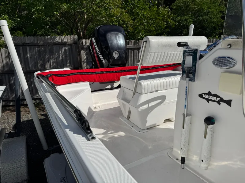 Slide: The Image of 2006 Sea Fox 185 Bay Fisher boat with Mercury engine, white seating, and red accents. - 12