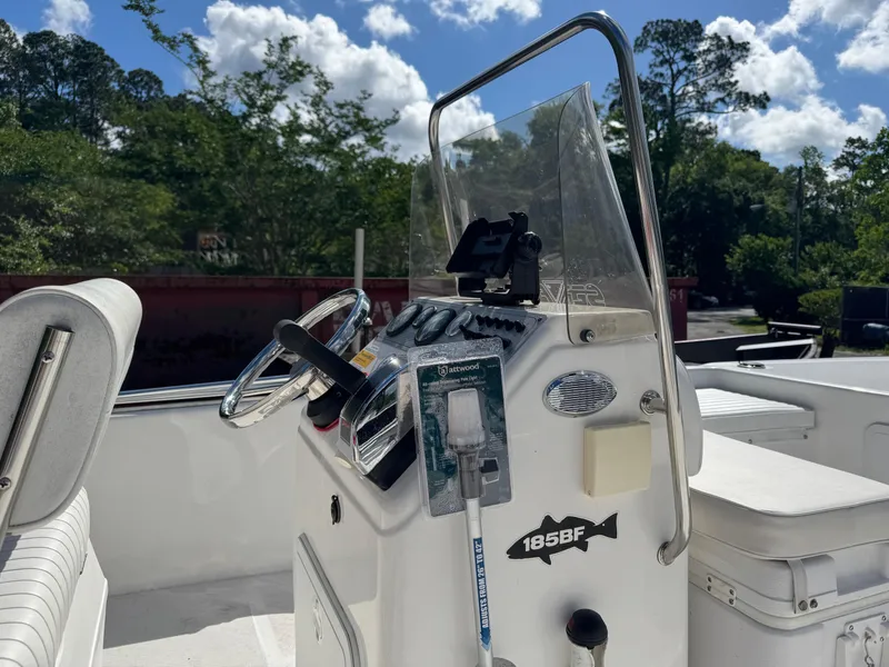 Slide: The Image of 2006 Sea Fox 185 Bay Fisher boat console with steering wheel and controls. - 13