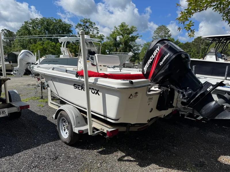 Slide: The Image of 2006 Sea Fox 185 Bay Fisher boat with Mercury outboard motor on trailer. - 3
