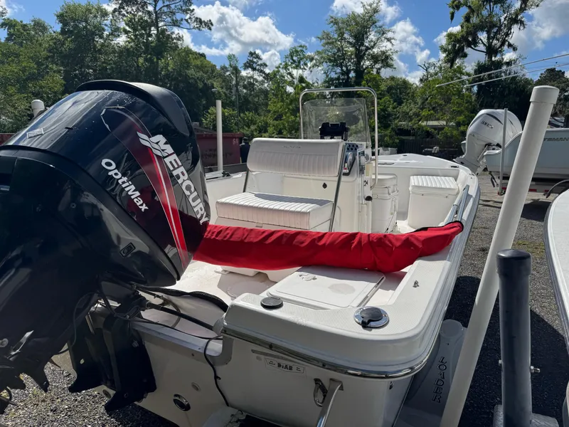 Slide: The Image of 2006 Sea Fox 185 Bay Fisher boat with Mercury Optimax engine, parked outdoors. - 5