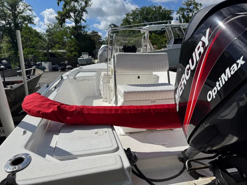 Slide: The Image of 2006 Sea Fox 185 Bay Fisher boat with Mercury OptiMax engine, docked outdoors. - 6