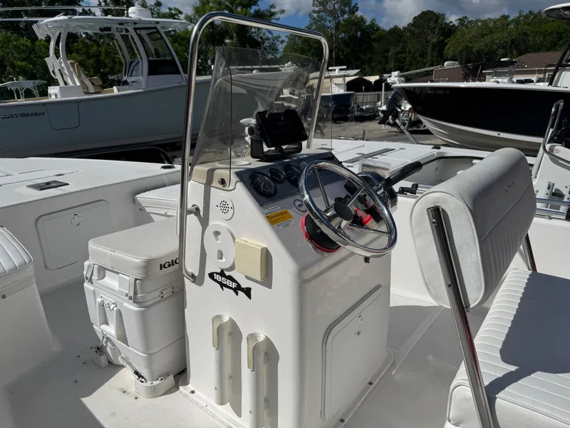 Slide: The Image of 2006 Sea Fox 185 Bay Fisher boat interior with steering console and seating. - 9