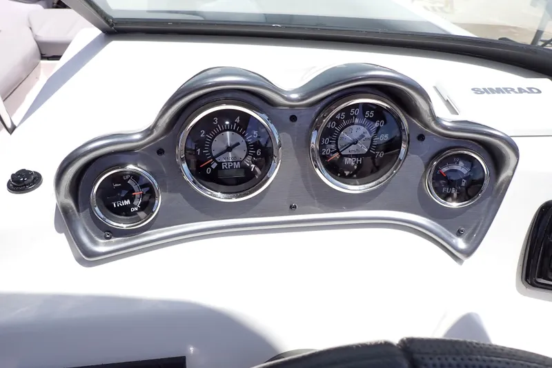 Slide: The Image of Dashboard of 2021 NauticStar 223 DC boat with gauges and Simrad display. - 11