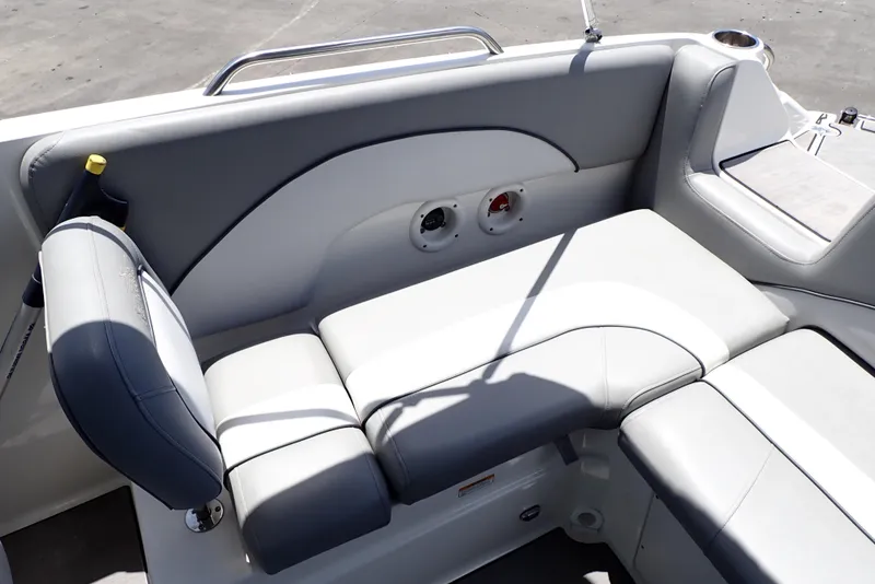 Slide: The Image of 2021 NauticStar 223 DC boat interior with gray cushioned seating. - 15