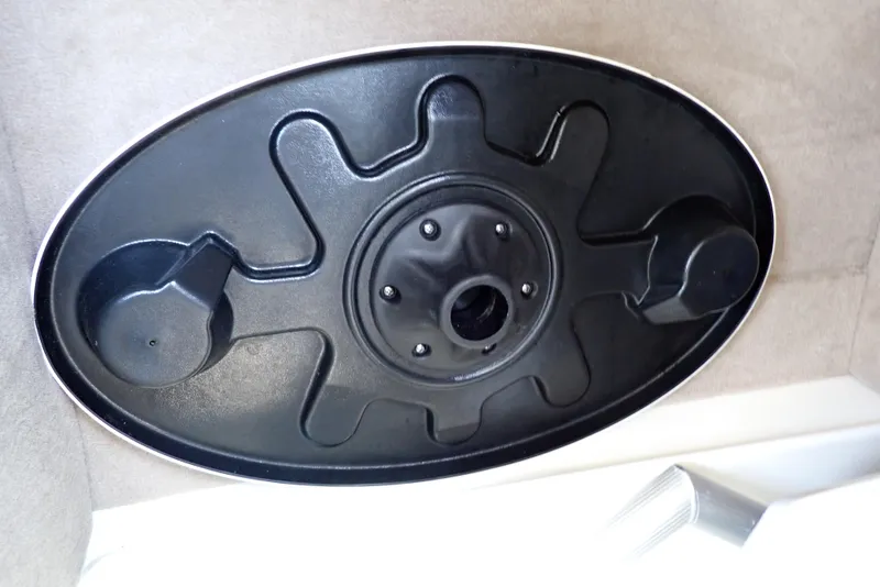 Slide: The Image of Black oval component on a 2021 NauticStar 223 DC boat interior. - 25