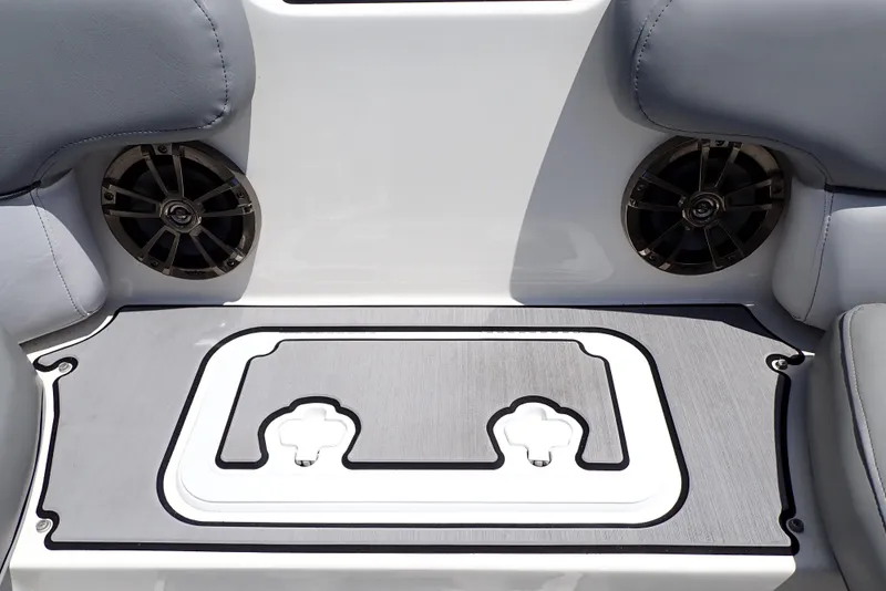 Slide: The Image of 2021 NauticStar 223 DC boat interior with speakers and seating area. - 32