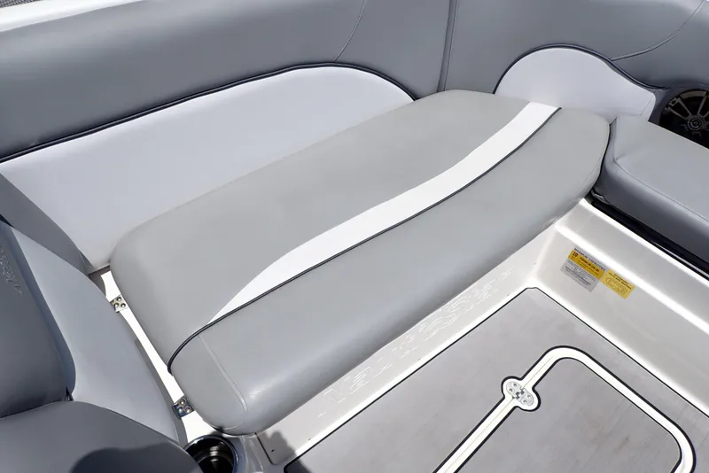 Slide: The Image of 2021 NauticStar 223 DC boat interior with gray and white cushioned seating. - 34