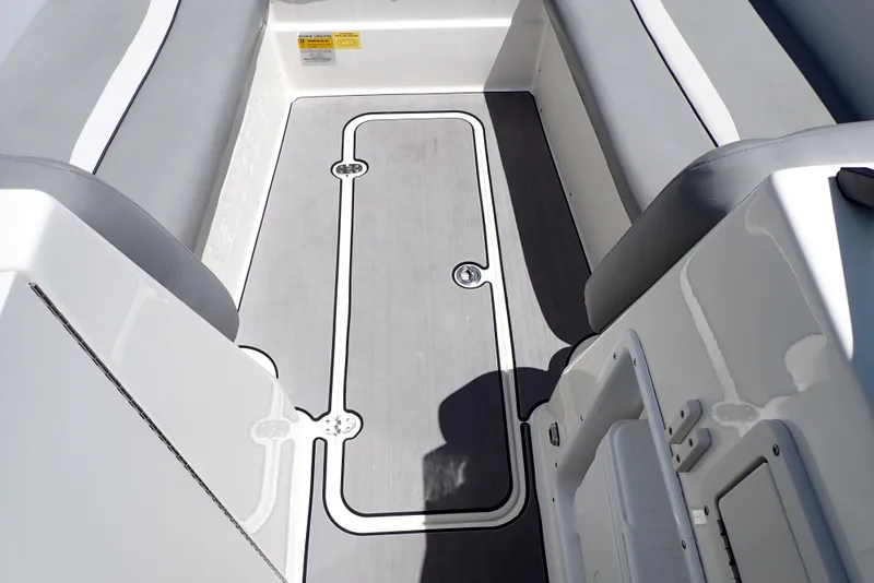 Slide: The Image of 2021 NauticStar 223 DC boat interior with sleek seating and modern flooring design. - 38
