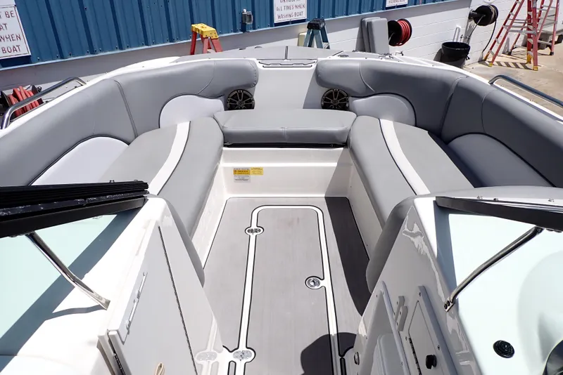 Slide: The Image of 2021 NauticStar 223 DC boat interior with gray seating and modern design. - 5