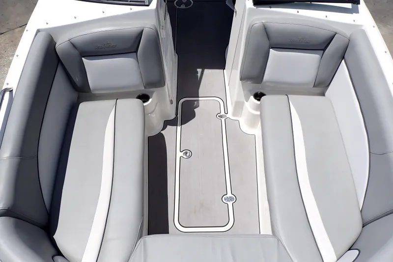 Slide: The Image of 2021 NauticStar 223 DC boat interior with gray seating and white accents. - 7