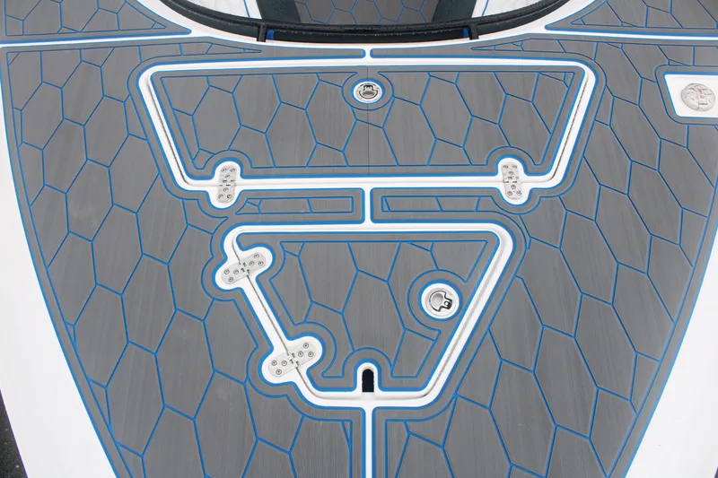 Slide: The Image of 2024 Fountain 34 SC boat deck with geometric pattern and blue accents. - 11
