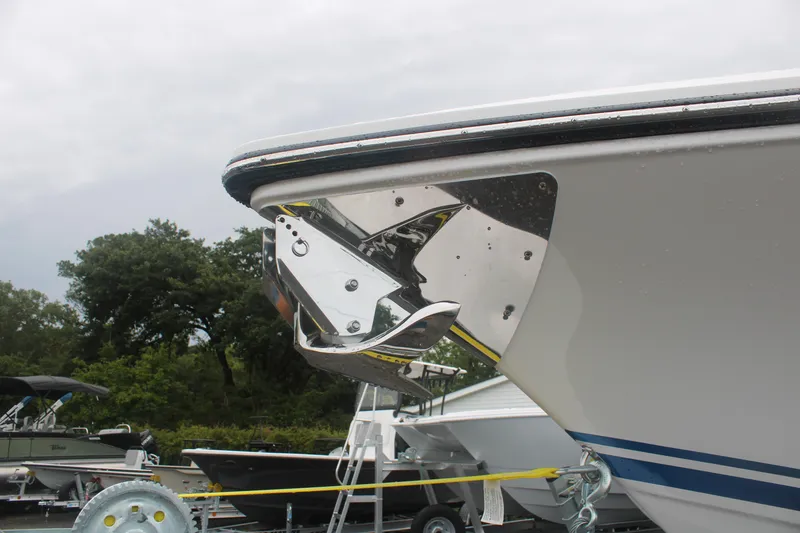 Slide: The Image of 2024 Fountain 34 SC boat with sleek chrome detailing and modern design. - 16