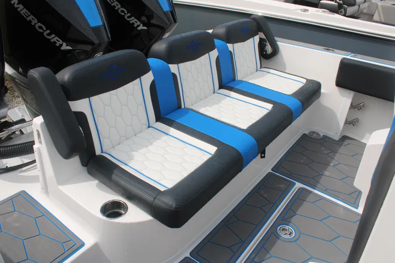 Slide: The Image of 2024 Fountain 34 SC boat seating with blue and white upholstery, featuring modern design and comfort. - 22