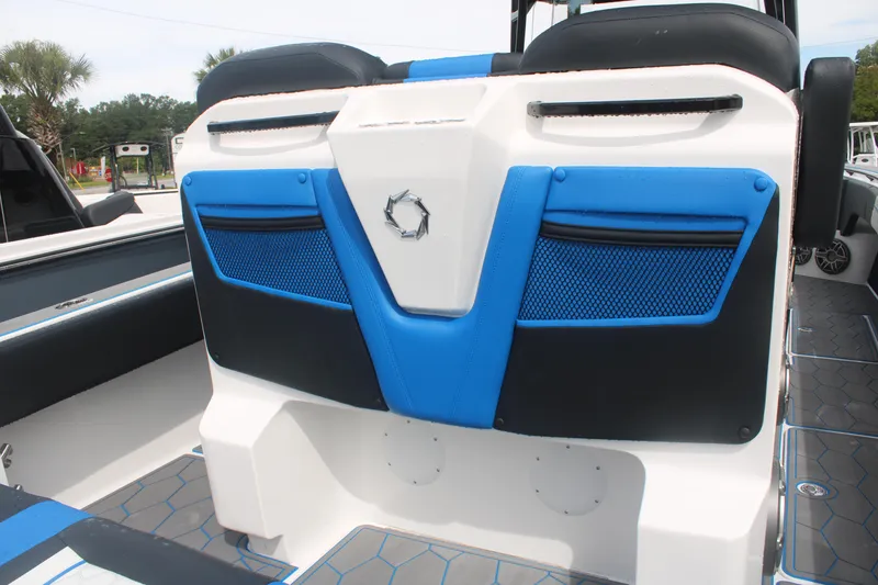 Slide: The Image of 2024 Fountain 34 SC boat interior with blue and black seating design. - 26