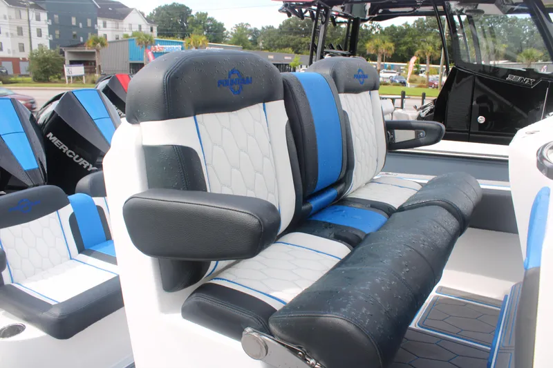 Slide: The Image of 2024 Fountain 34 SC boat seats with blue and white upholstery, showcasing luxury design. - 27