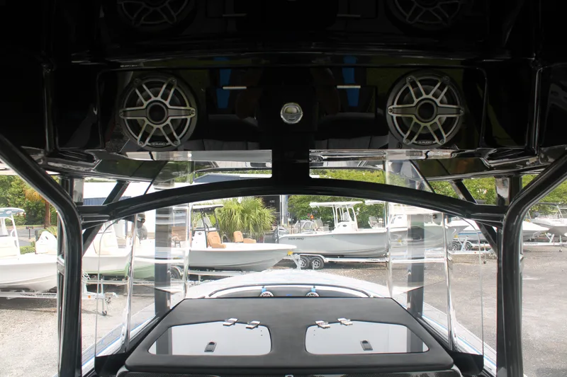 Slide: The Image of 2024 Fountain 34 SC boat interior with speakers and sleek design. - 33