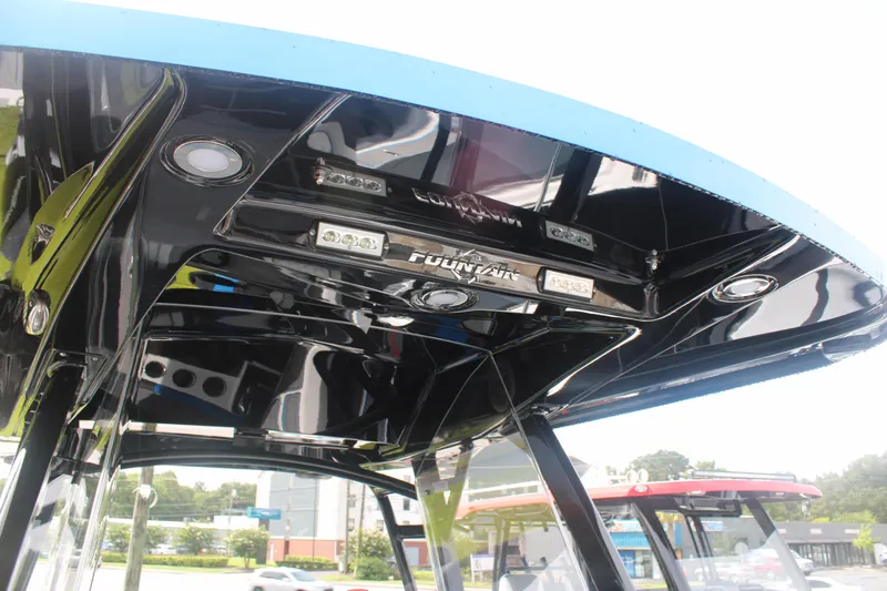 Slide: The Image of 2024 Fountain 34 SC boat interior with sleek black ceiling and integrated lighting. - 35