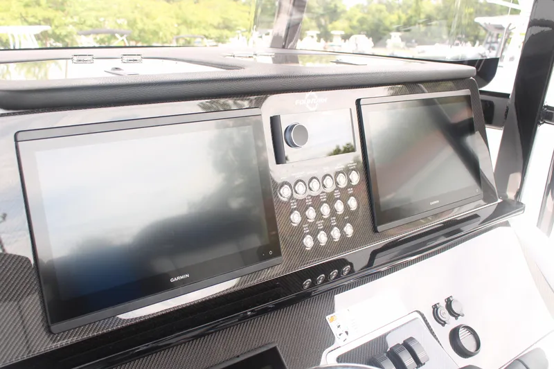Slide: The Image of 2024 Fountain 34 SC dashboard with dual screens and control panel. - 39