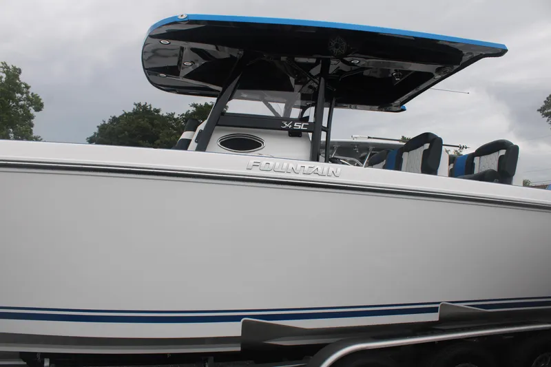 Slide: The Image of 2024 Fountain 34 SC boat with sleek design and blue accents. - 4