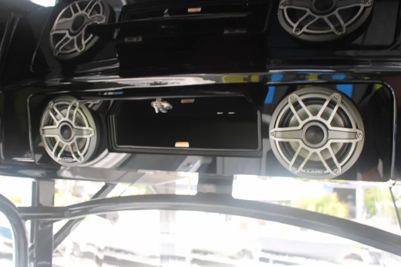 Slide: The Image of 2024 Fountain 34 SC boat speakers and storage compartment, featuring sleek design and modern audio system. - 41