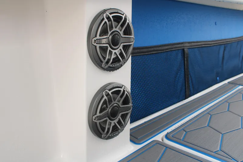 Slide: The Image of 2024 Fountain 34 SC boat speakers and deck detail with blue accents. - 43