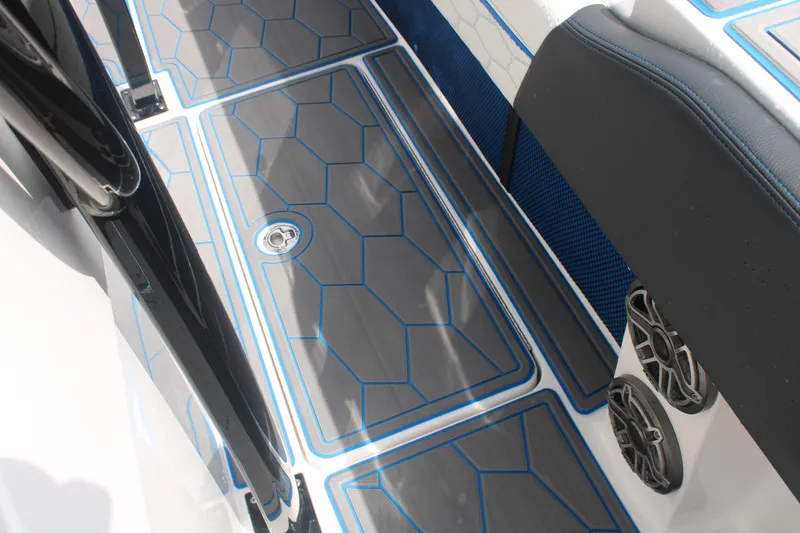 Slide: The Image of 2024 Fountain 34 SC boat deck with sleek, modern design and blue accents. - 45