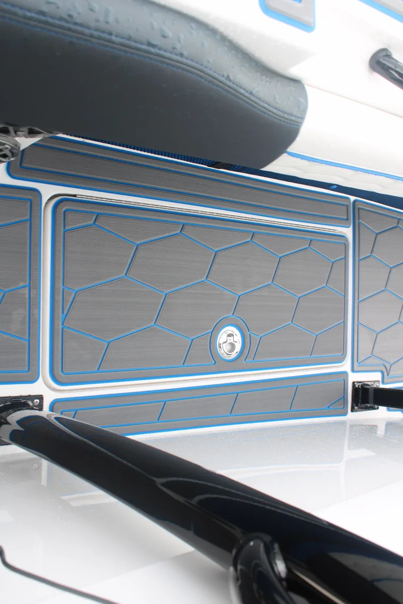 Slide: The Image of 2024 Fountain 34 SC boat interior with hexagonal pattern and blue accents. - 49