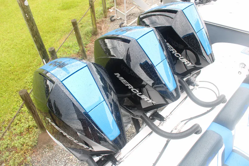 Slide: The Image of Three Mercury outboard engines on a 2024 Fountain 34 SC boat. - 9