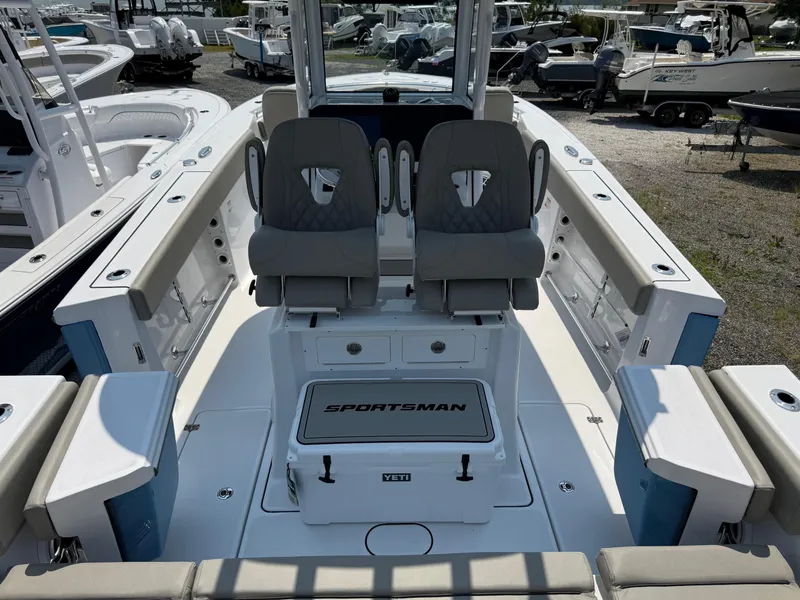 Slide: The Image of 2025 Sportsman Heritage 261 Center Console boat interior with dual seats and storage. - 11