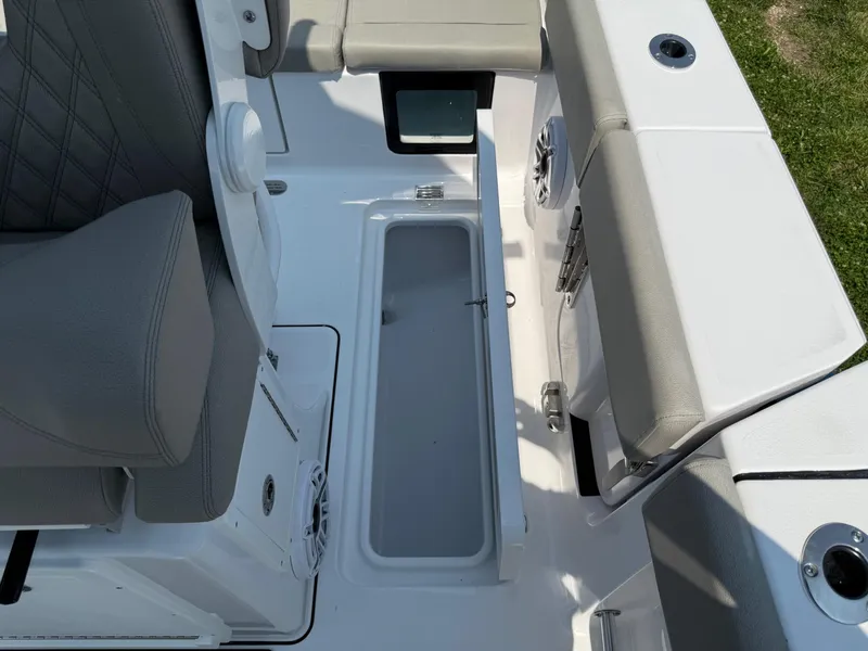 Slide: The Image of 2025 Sportsman Heritage 261 Center Console interior with seating and storage compartment. - 12
