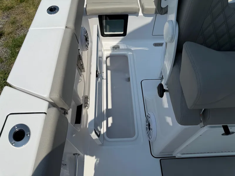 Slide: The Image of 2025 Sportsman Heritage 261 Center Console interior with seating and storage compartments. - 13