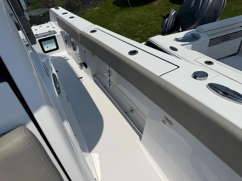Slide: The Image of 2025 Sportsman Heritage 261 Center Console boat interior with sleek design and modern features. - 17