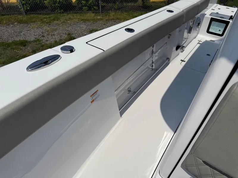 Slide: The Image of 2025 Sportsman Heritage 261 Center Console boat interior with sleek design and modern features. - 18