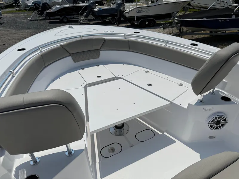 Slide: The Image of 2025 Sportsman Heritage 261 Center Console boat interior with seating and table. - 20