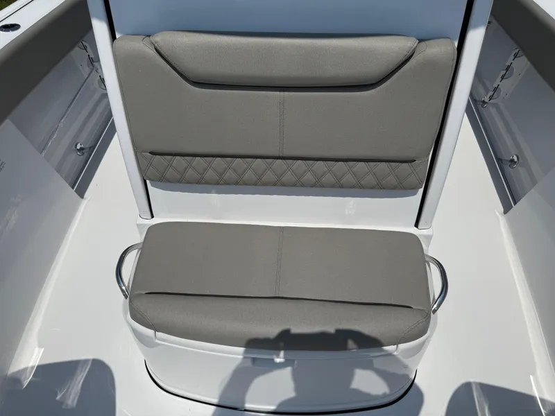 Slide: The Image of 2025 Sportsman Heritage 261 Center Console boat seating, featuring gray cushioned seats. - 23