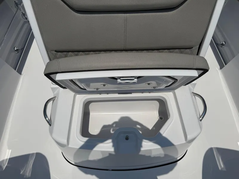 Slide: The Image of 2025 Sportsman Heritage 261 Center Console seat with storage compartment open. - 24