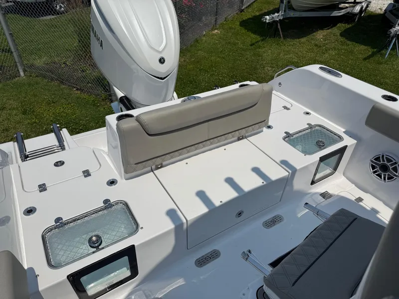 Slide: The Image of 2025 Sportsman Heritage 261 Center Console boat interior with seating and storage compartments. - 5