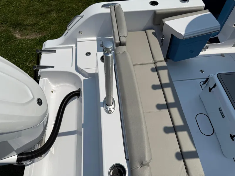 Slide: The Image of 2025 Sportsman Heritage 261 Center Console boat interior with seating and engine detail. - 7