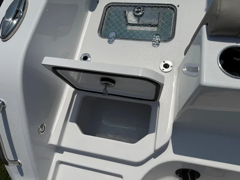 Slide: The Image of 2025 Sportsman Heritage 261 Center Console boat storage compartment detail. - 9