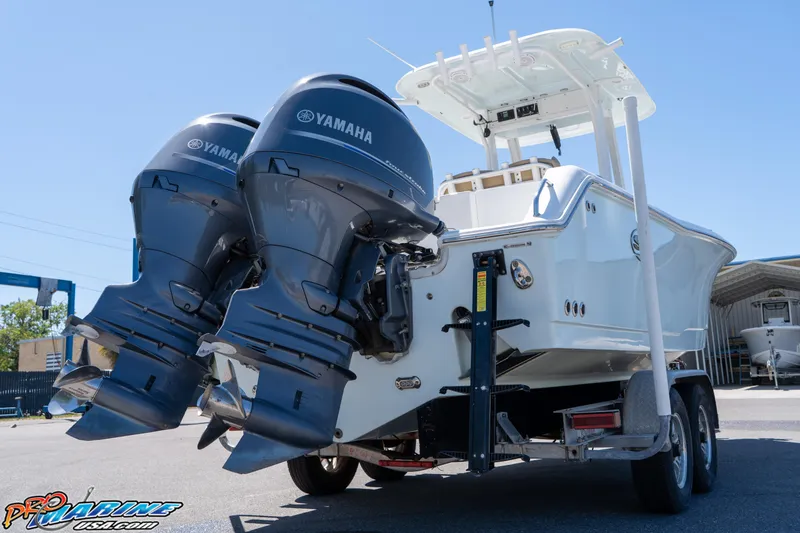 Slide: The Image of 2017 Sea Hunt Gamefish 25 boat with dual Yamaha outboard motors on a trailer. - 10