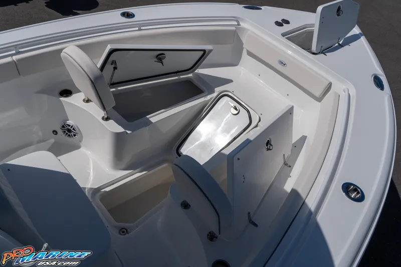 Slide: The Image of 2017 Sea Hunt Gamefish 25 boat interior with open storage compartments. - 2
