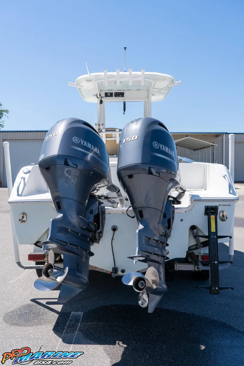 Slide: The Image of 2017 Sea Hunt Gamefish 25 with dual Yamaha outboard motors, rear view. - 9