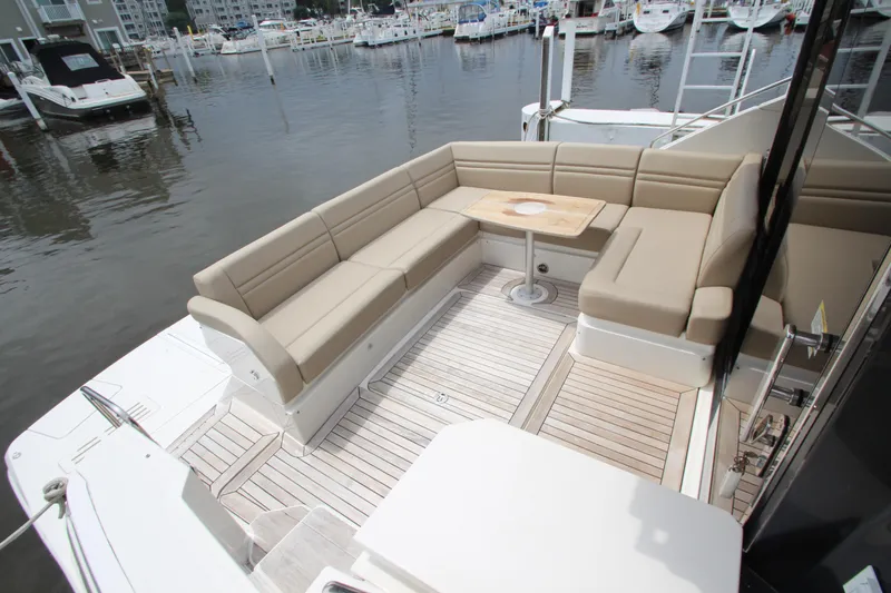 Slide: The Image of Luxurious 2016 Sea Ray 510 Sundancer yacht with spacious outdoor seating area. - 13