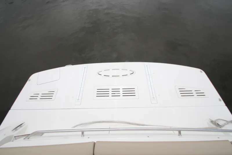 Slide: The Image of 2016 Sea Ray 510 Sundancer swim platform on calm water. - 19