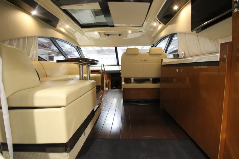 Slide: The Image of Luxurious interior of 2016 Sea Ray 510 Sundancer yacht with elegant seating and wood finishes. - 29