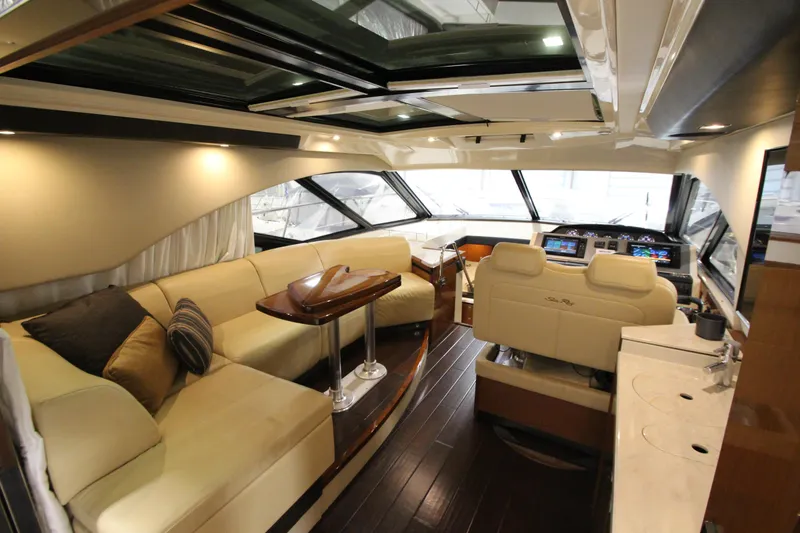 Slide: The Image of Luxurious interior of 2016 Sea Ray 510 Sundancer yacht with plush seating and modern helm. - 30