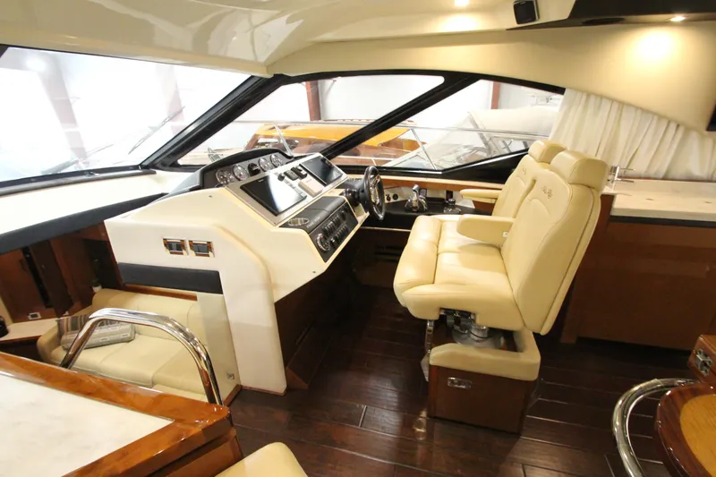 Slide: The Image of Luxurious interior of 2016 Sea Ray 510 Sundancer yacht with plush seating and modern controls. - 35