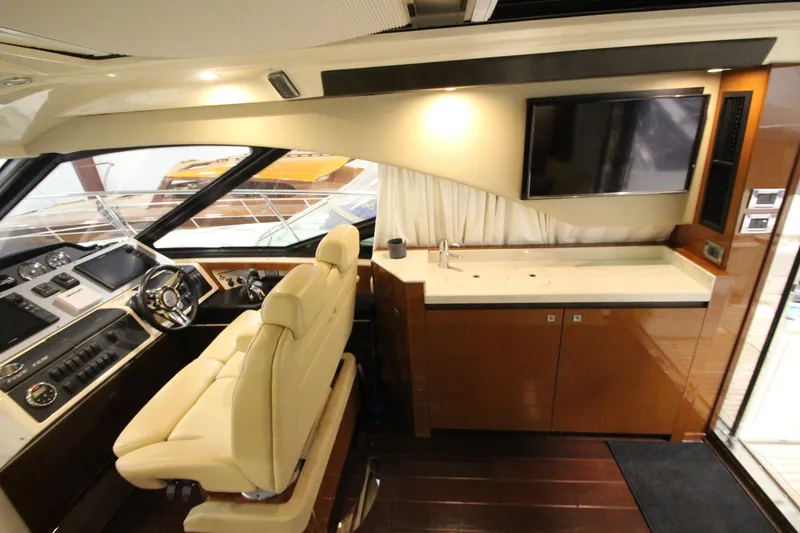 Slide: The Image of Luxurious interior of 2016 Sea Ray 510 Sundancer yacht with helm and entertainment area. - 36