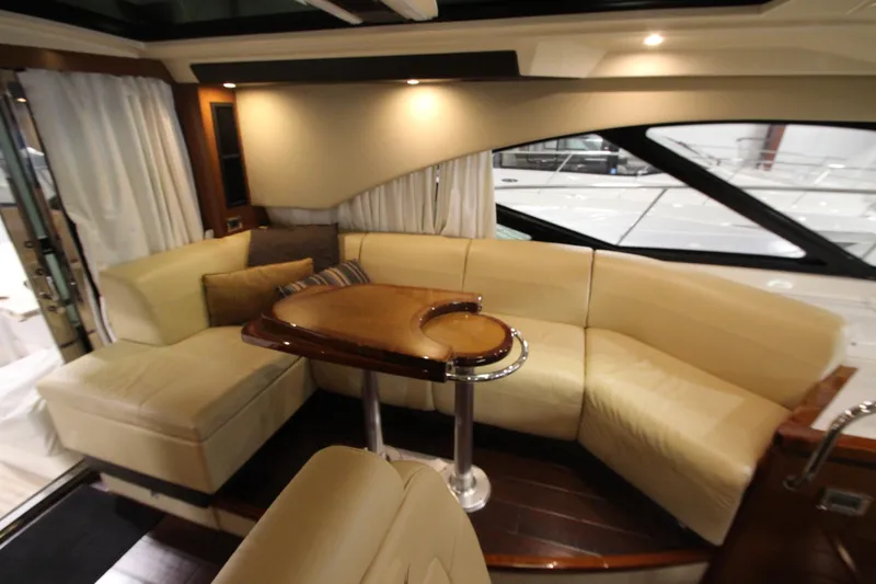 Slide: The Image of Luxurious interior of 2016 Sea Ray 510 Sundancer yacht with elegant seating and table. - 39
