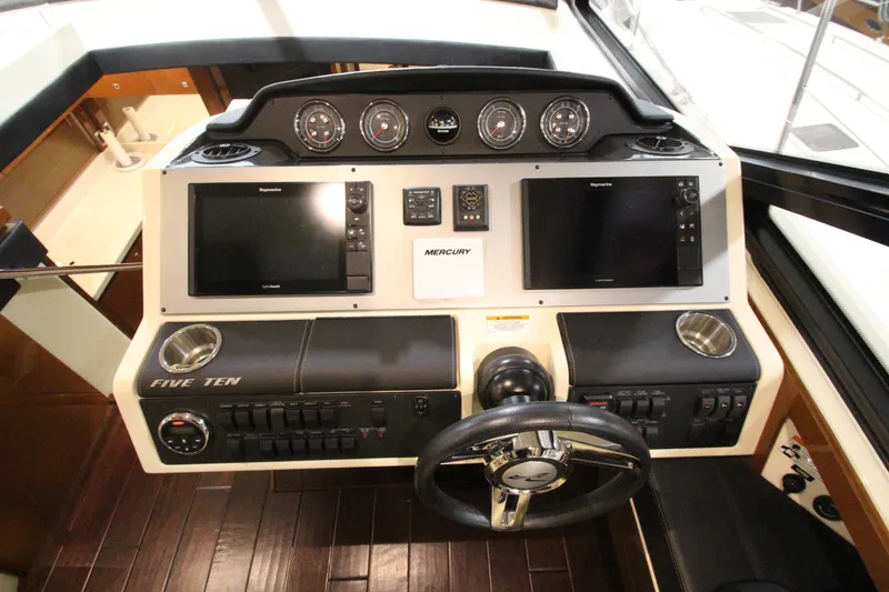 Slide: The Image of Helm of 2016 Sea Ray 510 Sundancer with dual displays and controls. - 41